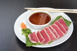 a plate of food with chopsticks