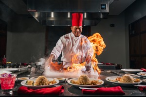 a chef cooking food in a kitchen