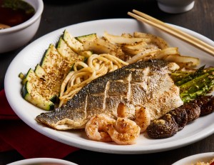 Our featured Summer Entrée showcases a delicate Branzino Filet served as part of a complete five-course hibachi meal. Paired with asparagus, shiitake mushrooms, udon noodles, and a refreshing miso lime dressing, this seasonal seafood entrée delivers a light yet satisfying summer dining experience.